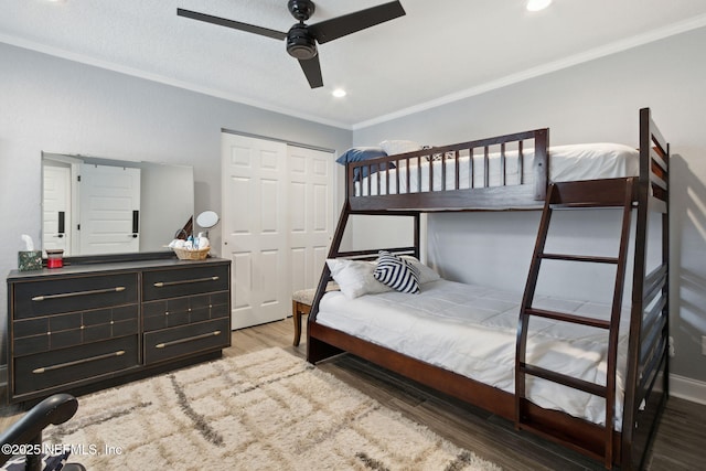 bedroom with recessed lighting, a closet, ornamental molding, ceiling fan, and wood finished floors