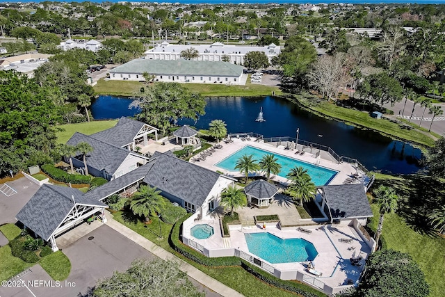 drone / aerial view with a water view and a residential view