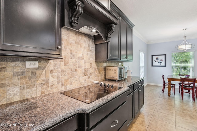 kitchen featuring light tile patterned floors, tasteful backsplash, ornamental molding, custom exhaust hood, and black electric stovetop