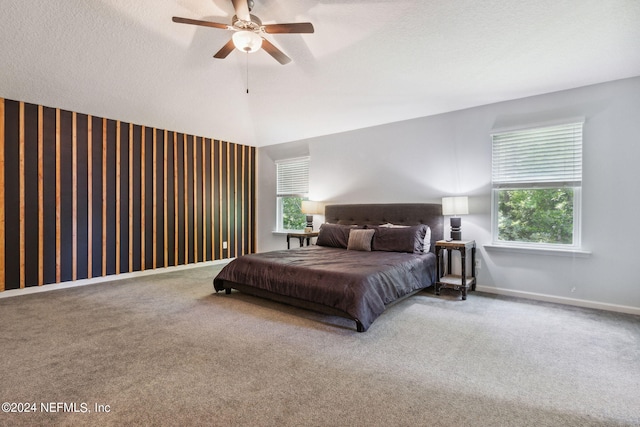 bedroom with carpet, baseboards, and a textured ceiling