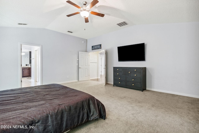 bedroom featuring lofted ceiling, carpet floors, and visible vents