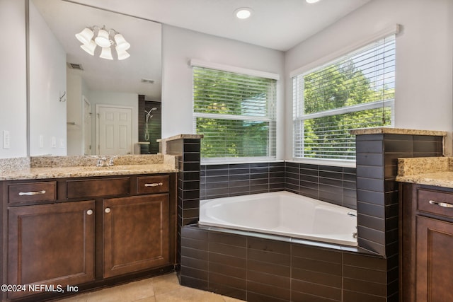 full bathroom featuring a garden tub, visible vents, a stall shower, vanity, and tile patterned flooring