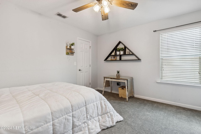 bedroom with a ceiling fan, carpet, visible vents, and baseboards