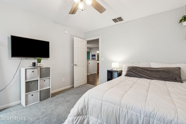 bedroom with baseboards, visible vents, ceiling fan, and carpet flooring