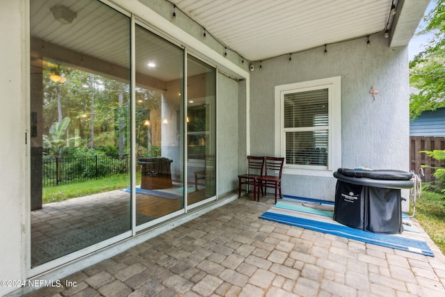 view of patio / terrace featuring fence