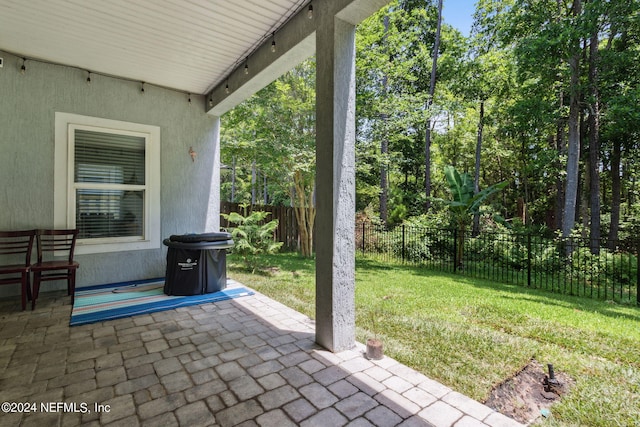 view of patio featuring fence