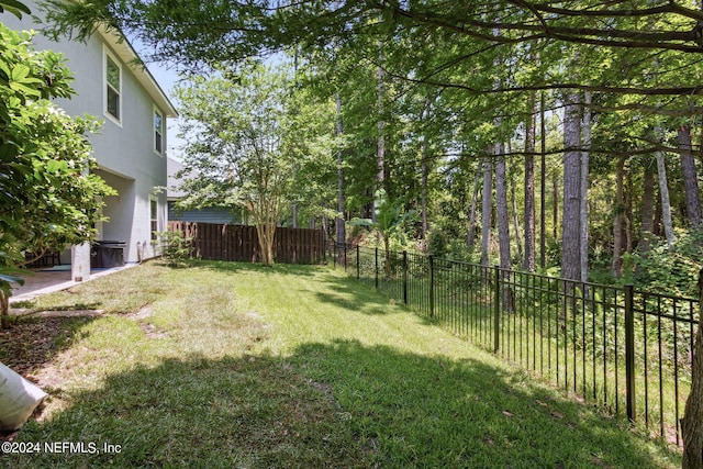 view of yard with a fenced backyard