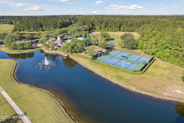 birds eye view of property featuring a water view and a forest view