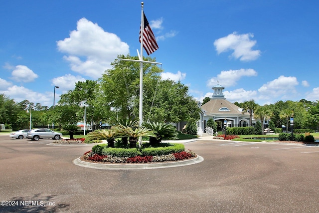 view of building exterior with uncovered parking