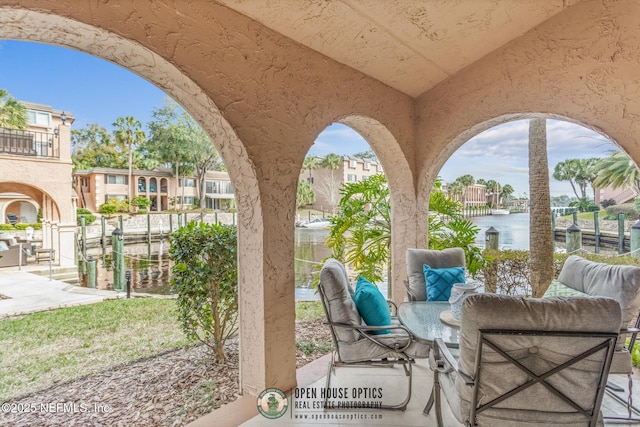 view of patio featuring a water view