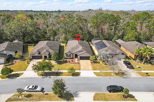 aerial view with a residential view and a view of trees