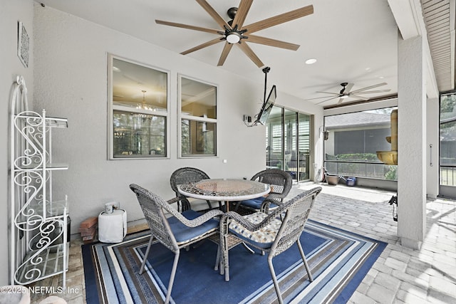 sunroom with a ceiling fan