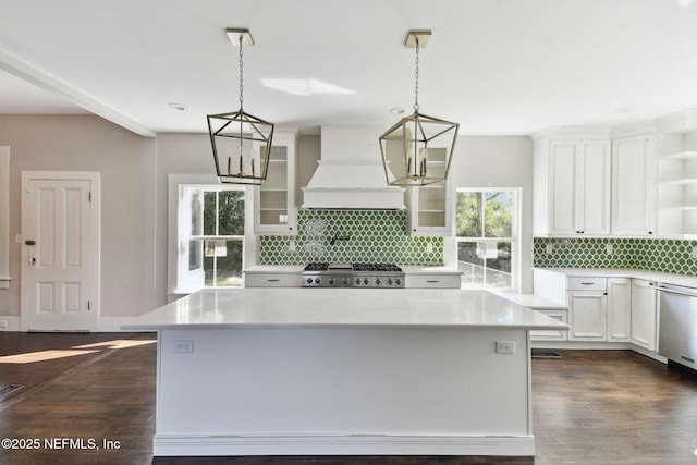 kitchen featuring dishwasher, custom exhaust hood, light countertops, white cabinetry, and open shelves