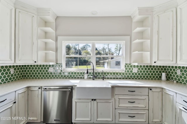 kitchen with light countertops, a sink, dishwasher, and open shelves