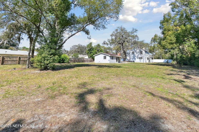 view of yard featuring fence