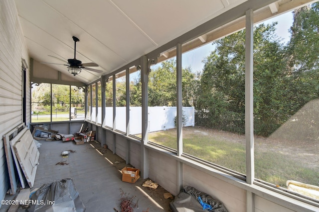 unfurnished sunroom featuring vaulted ceiling and ceiling fan