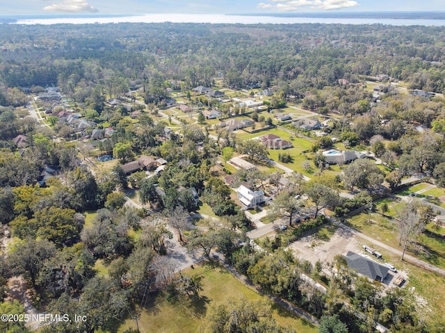 birds eye view of property featuring a residential view and a view of trees