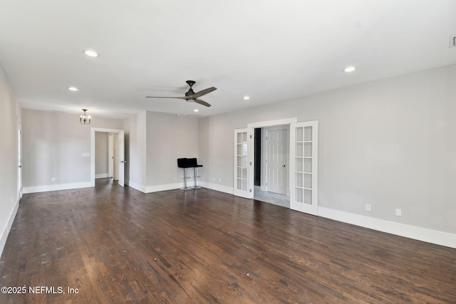 unfurnished living room featuring dark wood-style floors, french doors, recessed lighting, and baseboards