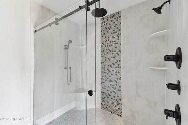 bathroom with a shower stall