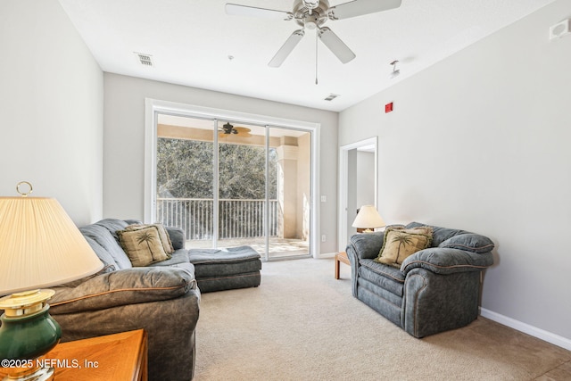 living room with carpet, visible vents, ceiling fan, and baseboards