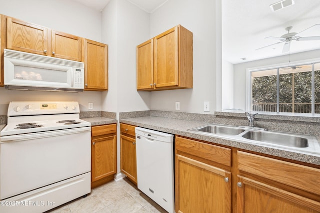 kitchen featuring ceiling fan, light tile patterned flooring, white appliances, a sink, and visible vents