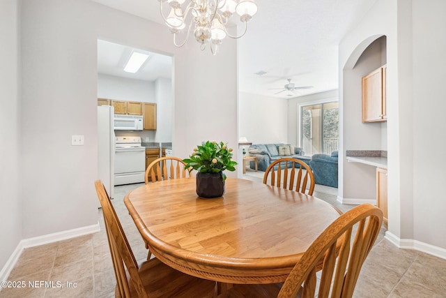 dining area with ceiling fan with notable chandelier, visible vents, baseboards, and light tile patterned floors