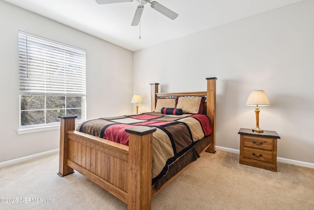 bedroom with light carpet, baseboards, and a ceiling fan