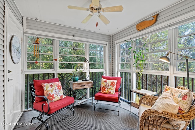 sunroom featuring a wealth of natural light and a ceiling fan