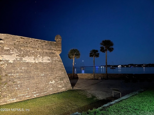 yard at night with a water view