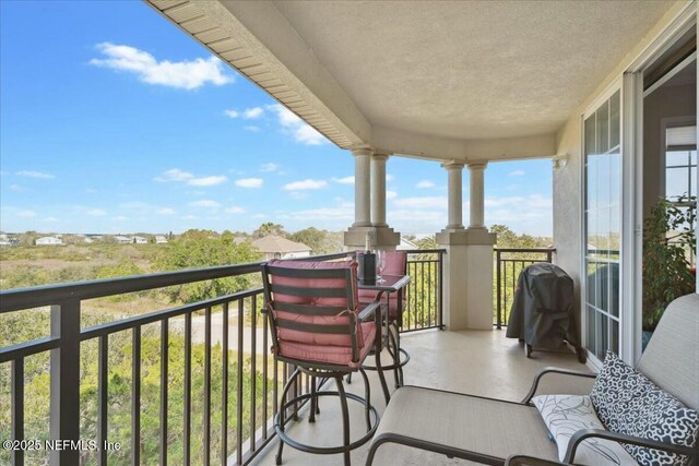 balcony featuring area for grilling