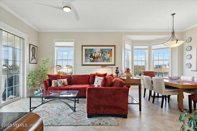 living room featuring light tile patterned floors, a healthy amount of sunlight, and crown molding