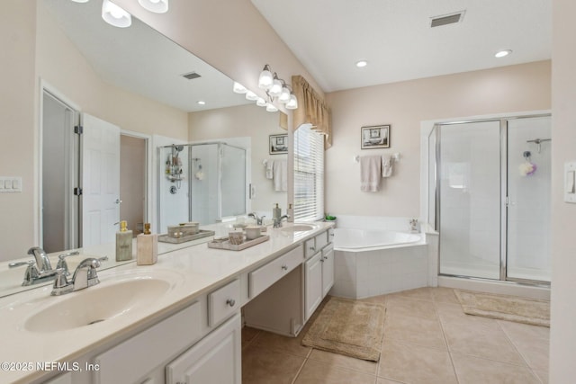 full bathroom with a garden tub, tile patterned flooring, a sink, visible vents, and a stall shower