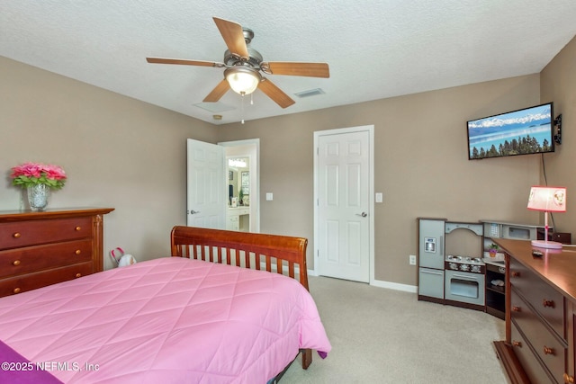 bedroom featuring a textured ceiling, light colored carpet, a ceiling fan, baseboards, and visible vents