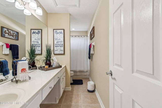 full bath with curtained shower, toilet, vanity, baseboards, and tile patterned floors