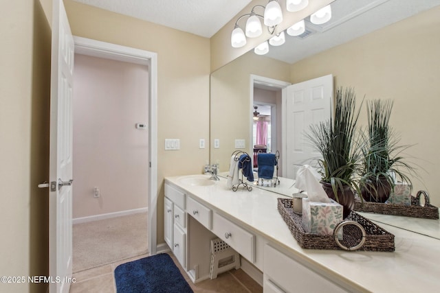 bathroom featuring vanity and baseboards