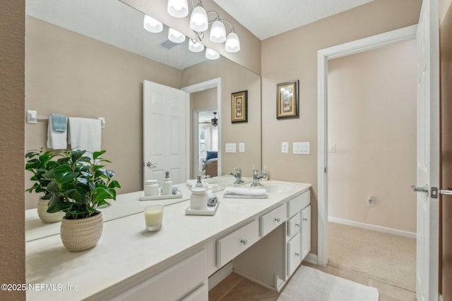 bathroom featuring visible vents, ensuite bath, vanity, and baseboards