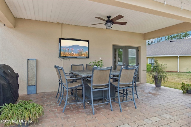 view of patio / terrace featuring a ceiling fan and outdoor dining space