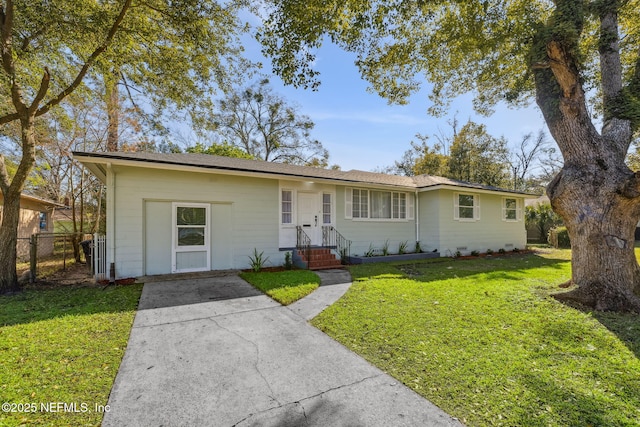 ranch-style house featuring crawl space, a front yard, and fence