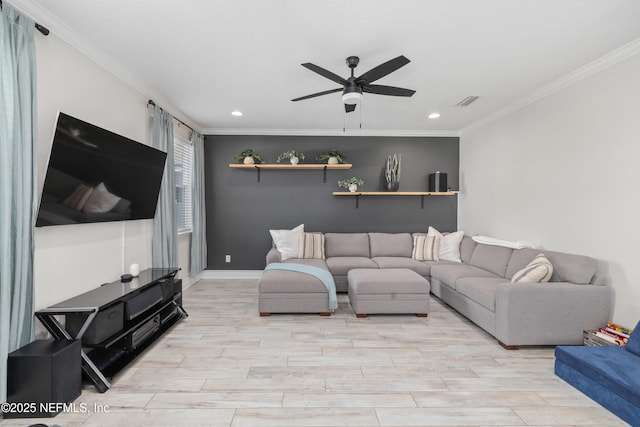 living area featuring wood tiled floor, visible vents, ceiling fan, and crown molding