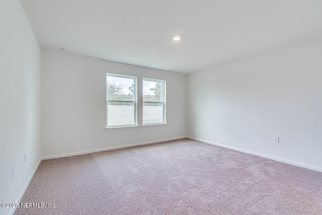 unfurnished room with recessed lighting, carpet, and baseboards