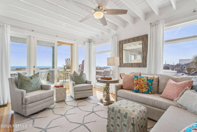 sunroom / solarium featuring beam ceiling, visible vents, and ceiling fan