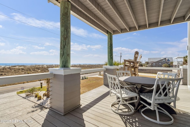 wooden terrace featuring outdoor dining area