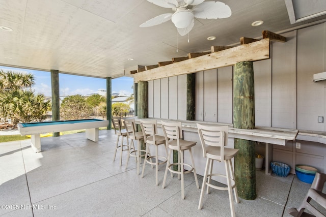 view of patio / terrace with ceiling fan and outdoor dry bar