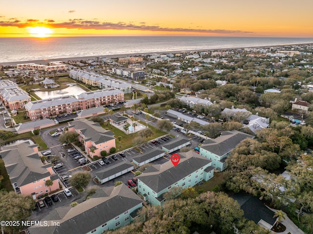 aerial view at dusk with a water view