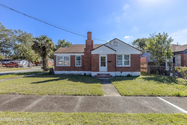 bungalow-style house with brick siding, crawl space, a chimney, and fence