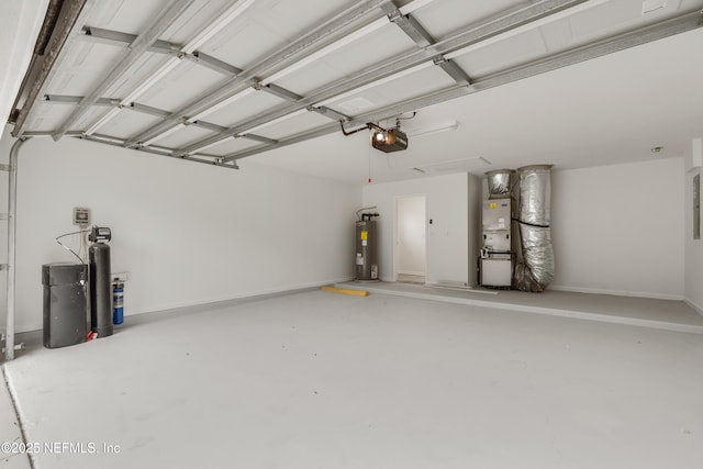 garage featuring heating unit, a garage door opener, and electric water heater