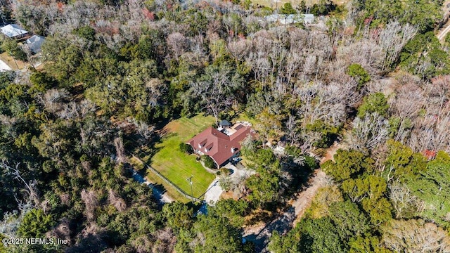 aerial view featuring a view of trees