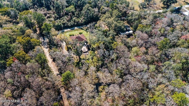 aerial view featuring a wooded view