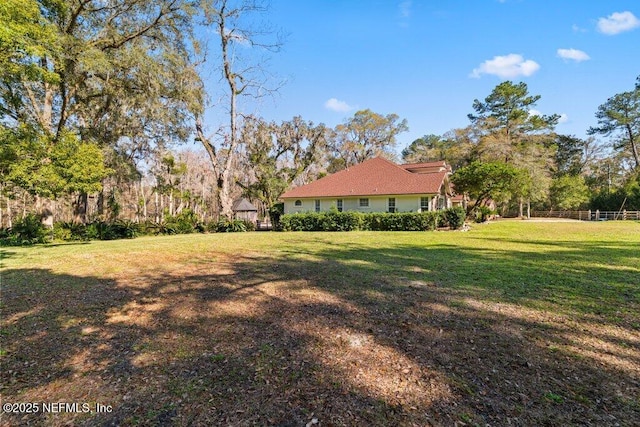 view of yard featuring fence