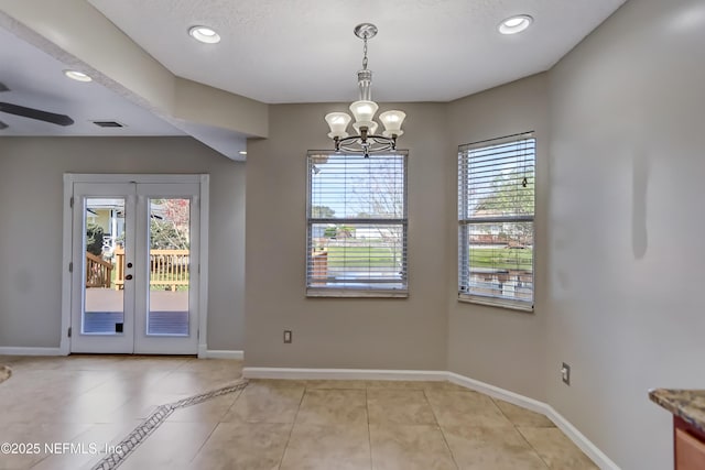 unfurnished dining area with recessed lighting, a healthy amount of sunlight, baseboards, and light tile patterned floors